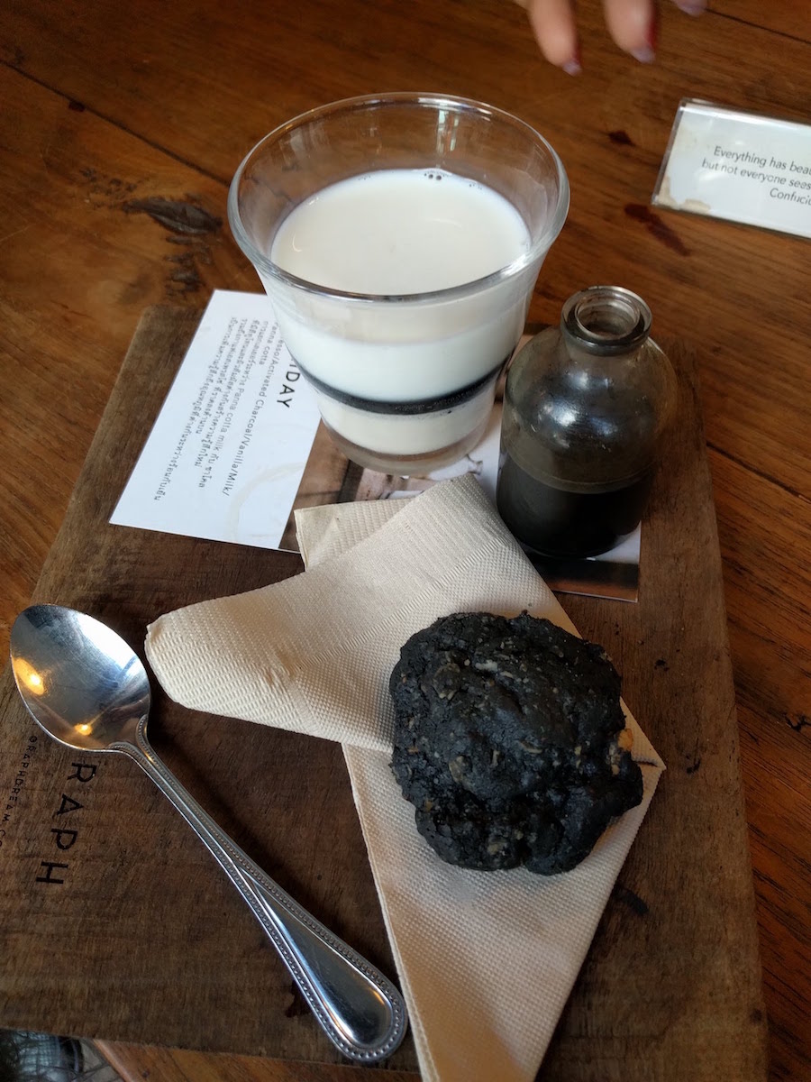 Charcoal activated coffee over panna cotta with charcoal chocolate cookie